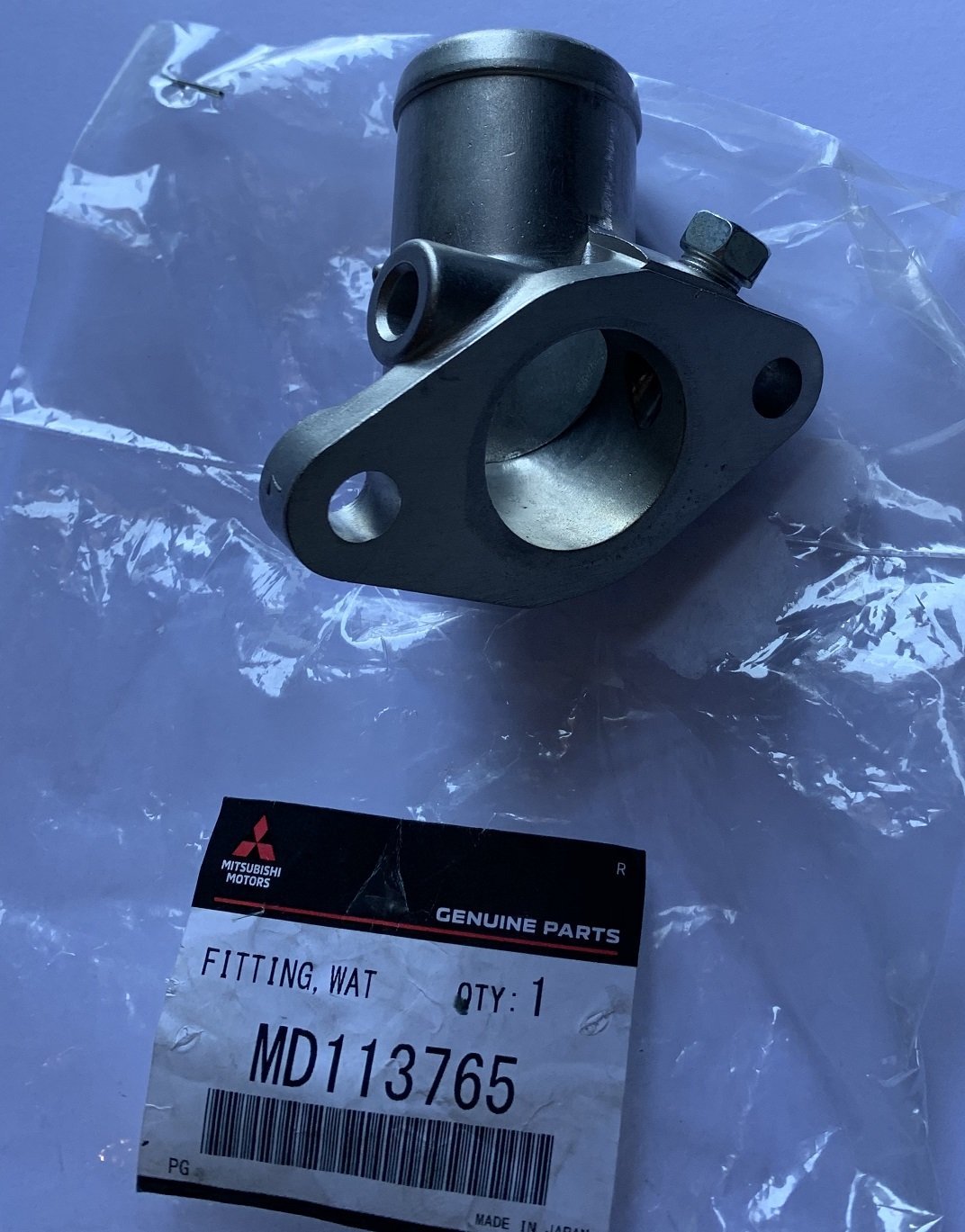 FLANGIA TERMOSTATO/ RACCORDO USCITA ACQUA MITSUBISHI PAJERO I (ORIGINALE) - Autoricambi4x4